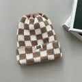 Close-up of thick checkered knit beanie in brown and white tones - Elastic Circumference / White Khaki Plaid