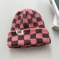Detailed macro shot of a pink and brown checkered thick knit winter warm beanie hat - Elastic Circumference / Pink Gingham