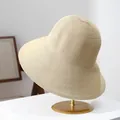 Detailed macro view showing the fine woven texture of a beige wide-brim women's summer sun hat - M (56-58cm) / Beige