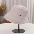 Detail view of a beige pleated Japanese style bucket hat on a black display stand - Adjustable (56-58cm) / Off White