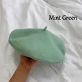 Close-up view of a soft mint green wool beret hat, a classic winter fashion accessory - M (56-58cm) / Mint Green