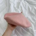 Detailed view of a soft baby pink wool beret hat, classic solid color painter cap - M (56-58cm) / Baby Pink