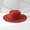 Detailed macro view of a vintage red wool felt flat-top boater hat with dome crown - M (56-58cm) Adjustable / Caramel color