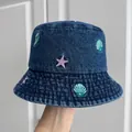 Detail of children's denim bucket hat with seashell and starfish embroidery motifs. - Adult Head Circumference (56-58cm) / Dark Blue Conch