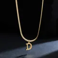 Macro detail of high-quality gold plated stainless steel necklace with letter D pendant - Letter D (11851_4) / Gold