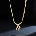 Macro view of gold 18K plated stainless steel snake chain featuring a letter H pendant - Letter H (11851_8) / Gold