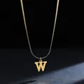 Detailed shot of a gold stainless steel necklace featuring a bold 'W' initial pendant. - Letter W (11851_23) / Gold