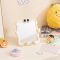 Cute cream-colored desktop makeup mirror with unique wavy frame and googly eyes design - Beige