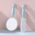 Portable light blue cosmetic hand mirror and comb set with cute bunny-shaped handles - Light Blue