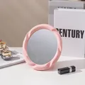 Eleganter rosa Tisch-Make-up-Spiegel mit stilvollem Wellenrahmen-Design für Tisch - Spiralförmiger Ovaler Stil (Rosa)