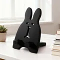 Supporto da tavolo nero minimalista a forma di coniglio per telefoni e tablet vari - Nero