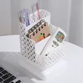 White 3-tier hollow plastic desk organizer shown with pens and remote control holder - White