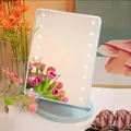 Light blue desktop LED makeup mirror with 16 light bulbs and circular base - Storage / Blue