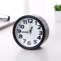 Modern round black desktop alarm clock with white dial face and luminous green hands - Round / Round Black