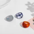 Detailed view of trendy marbled acrylic rings set in grey, purple and amber tones - Three-Piece Set / Gray Purple Amber Marble Pattern Set (R176_1)