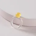 Modern minimalist clear acrylic ring featuring a vibrant translucent yellow sphere accent. - Yellow Round Ball Decor Transparent Ring (R177_2)