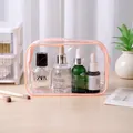 Portable transparent PVC waterproof makeup bag with pink zipper for travel toiletries - Pink