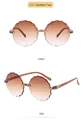 Detail view of flower-shaped kids' sunglasses in gradient tea color from front and side angles - Rimless Scalloped Edge (79006K) / Gradient Tea