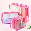 Set mit 3 pinkfarbenen transparenten PVC-Kulturbeuteln für Kosmetik und Zubehör - Kleines Rosarot