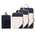 Navy blue compression travel packing cubes set featuring a diamond lattice pattern - Four-Piece Set / Navy Blue