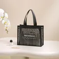 Black breathable nylon mesh tote bag for toiletries and cosmetics shown in lifestyle setting - Black Small / 34x26x11cm