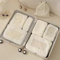 Set of 7 off-white Taslon travel packing cubes for clothes organization in suitcase - Beige