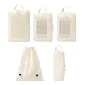 5-piece off-white Taslon compression packing cubes set for travel organization - Beige