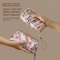 Portable mini sun umbrella with 14cm folded length and elegant floral storage pouch - Angel Floral With Clutch Bag