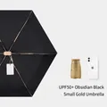Mini portable UPF50+ folding UV protection sun umbrella in obsidian black and gold - Black