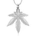 Close-up view of silver maple leaf cremation urn necklace for pet or human ashes keepsake. - Silver
