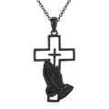 Close-up of black stainless steel cross pendant with praying hands design - Black Cross