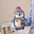 Adorable plush penguin doll dressed in a warm winter hat and colorful knit scarf. - 20cm / Blue