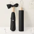 Elegante paraguas plegable negro para sol y lluvia con detalle único de mango de lazo - Negro