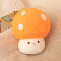 Adorable orange mushroom plush toy with white polka dots sitting on a cozy beige blanket - Orange