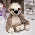 Cute sloth plush toy with soft brown fur sitting on a white desk - Camel Sloth