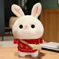 Cute white rabbit plush toy wearing a red knitted sweater and small tan shoulder bag - Red Sweater With Snowflake Pattern And Bag