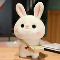 Adorable white rabbit plush doll wearing a cream knitted sweater and small tan bag - Off-White Sweater With Double Heart And Bag