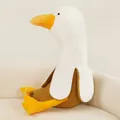 Creative banana duck plush toy sitting on a white sofa in a cozy interior scene - Yellow Brown / 50cm
