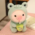 Lindo peluche de cerdo con disfraz de rana verde sosteniendo un té de aguacate - 25cm / Estilo Rana