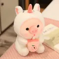 Lindo peluche de cerdo con capucha de unicornio sosteniendo una taza de té de melocotón. - 25cm / Diseño de Unicornio