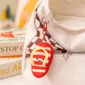 Pendentif de sac créatif en peluche à rayures rouges avec un joli visage souriant - Mini pendentifs pantoufle