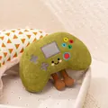 Cute green plush toy shaped like a retro game controller with tiny legs and a smiley face. - Green Game Controller / Handle
