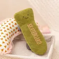 Retro green plush toy shaped like a vintage mobile phone with pink skateboard embroidery - Skateboard