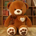 Large brown stuffed teddy bear with decorative heart patch and soft plush bow tie - 80cm / Happy Every Day / Dark Brown