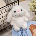Soft white long-eared bunny plush toy doll sitting on a blue book for home decor - Little White Rabbit / 15cm