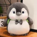 Chubby grey and white penguin plush toy with cute bowtie and green backpack straps - Turtle Backpack - Penguin Brother / 20cm