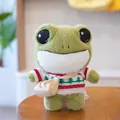 Adorable large-eyed plush frog toy wearing a Christmas tree knit sweater and small bag - 29cm / Forest Sweater (dpx-frog)