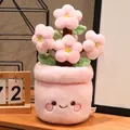 Linda planta de peluche de flor de cerezo rosa en maceta con cara sonriente para mesa - Decoración de flor de durazno en maceta