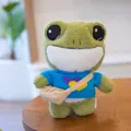 Cute plush frog toy wearing a blue heart-pattern sweater and a small beige messenger bag - 29cm / Blue Heart (dpx-frog)