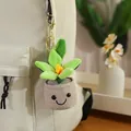 Cute smiling plush succulent plant keychain in a brown pot hanging on a cream backpack - Lily Potted Pendant - Green / 12-16cm Pendant